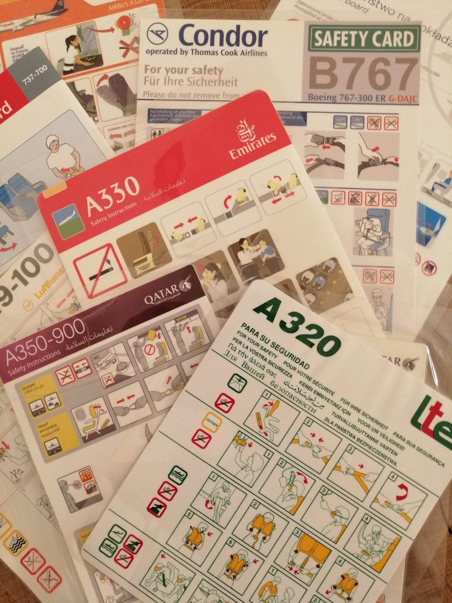 Lot of 10 Airline Safety Cards | Qatar Lufthansa Emirates LTE Condor Thai KLM | Boeing Airbus