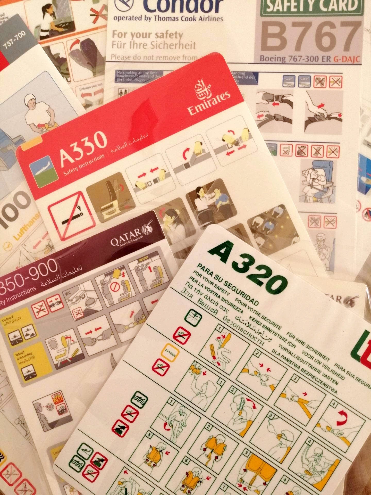 Lot of 10 Airline Safety Cards | Qatar Lufthansa Emirates LTE Condor Thai KLM | Boeing Airbus