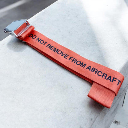 Aircraft Safety Demonstration Original Seat Belt Do Not Remove from Aircraft Orange